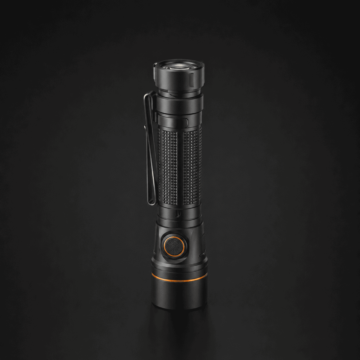 Northbeam One compact black rechargeable flashlight with orange control accents.